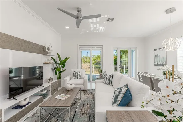 a view of a dining room filled with furniture and window