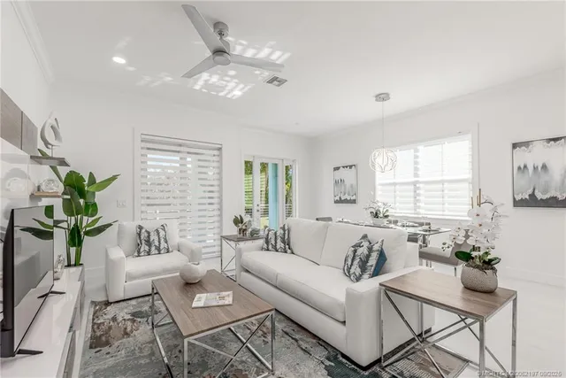 a kitchen with kitchen island a appliances a sink and a refrigerator
