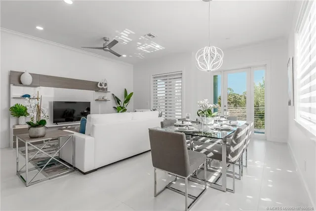 a bathroom with a granite countertop sink vanity mirror and toilet