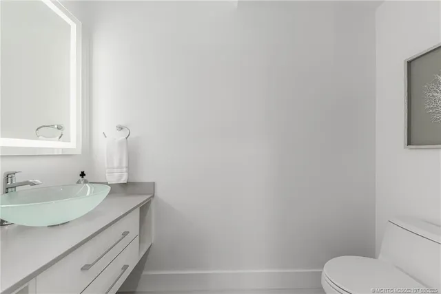 a view of a room with wooden floor and a window