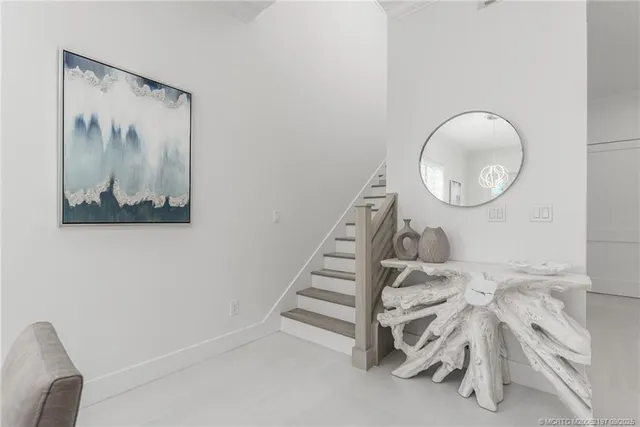 a bedroom with a bed and a potted plant