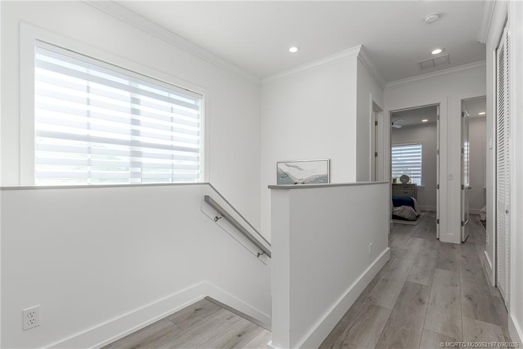 4674 Southeast Manatee Terrace Stuart, FL 34997 - Photo 44 of 55 a view of a room with wooden floor and a window