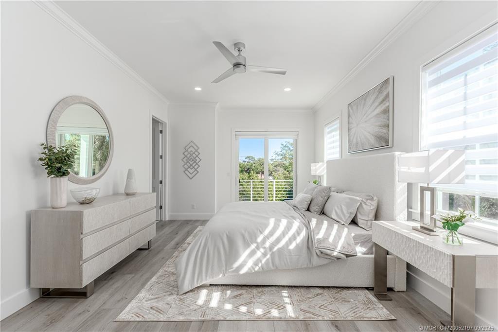 4674 Southeast Manatee Terrace Stuart, FL 34997 - Photo 45 of 55 a living room with furniture and a large window