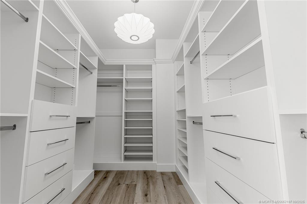 4674 Southeast Manatee Terrace Stuart, FL 34997 - Photo 5 of 55 a view of walk in closet with empty racks