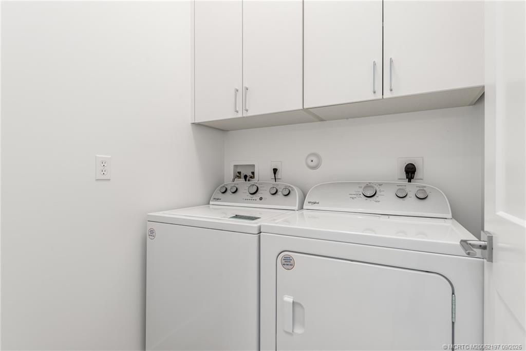 4674 Southeast Manatee Terrace Stuart, FL 34997 - Photo 52 of 55 a utility room with dryer and washer