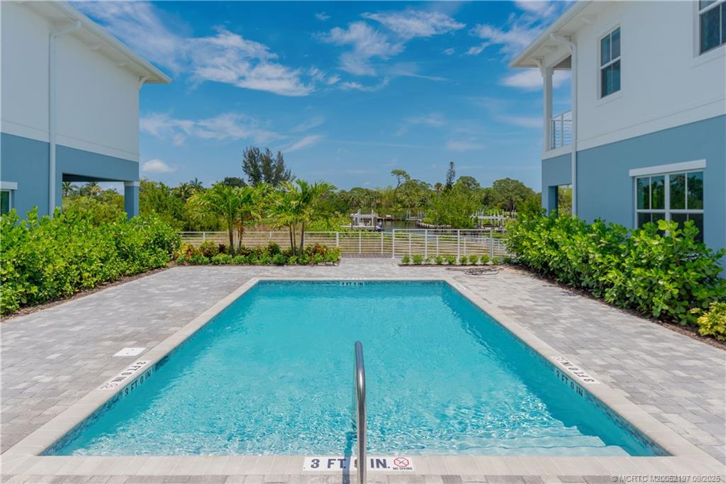 4674 Southeast Manatee Terrace Stuart, FL 34997 - Photo 54 of 55 a view of a backyard