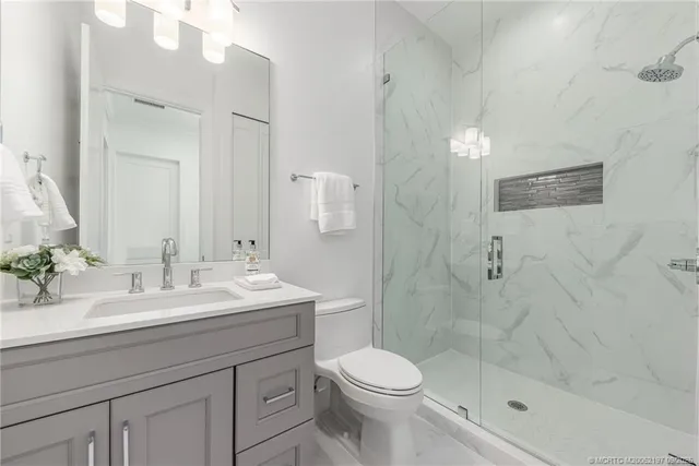 a bedroom with bed and a window