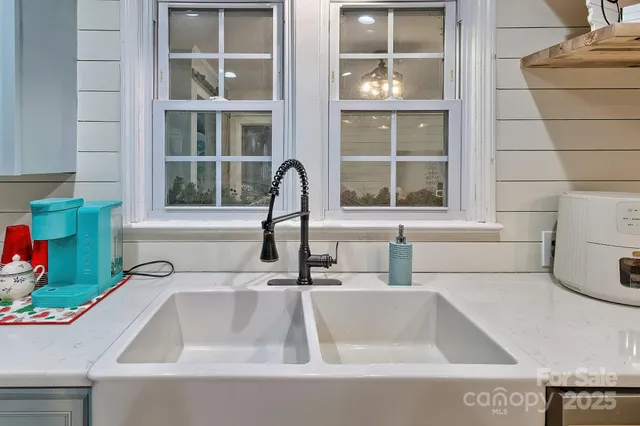 a bathroom with a sink and a large window