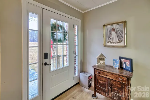 a view of room with window and wooden floor