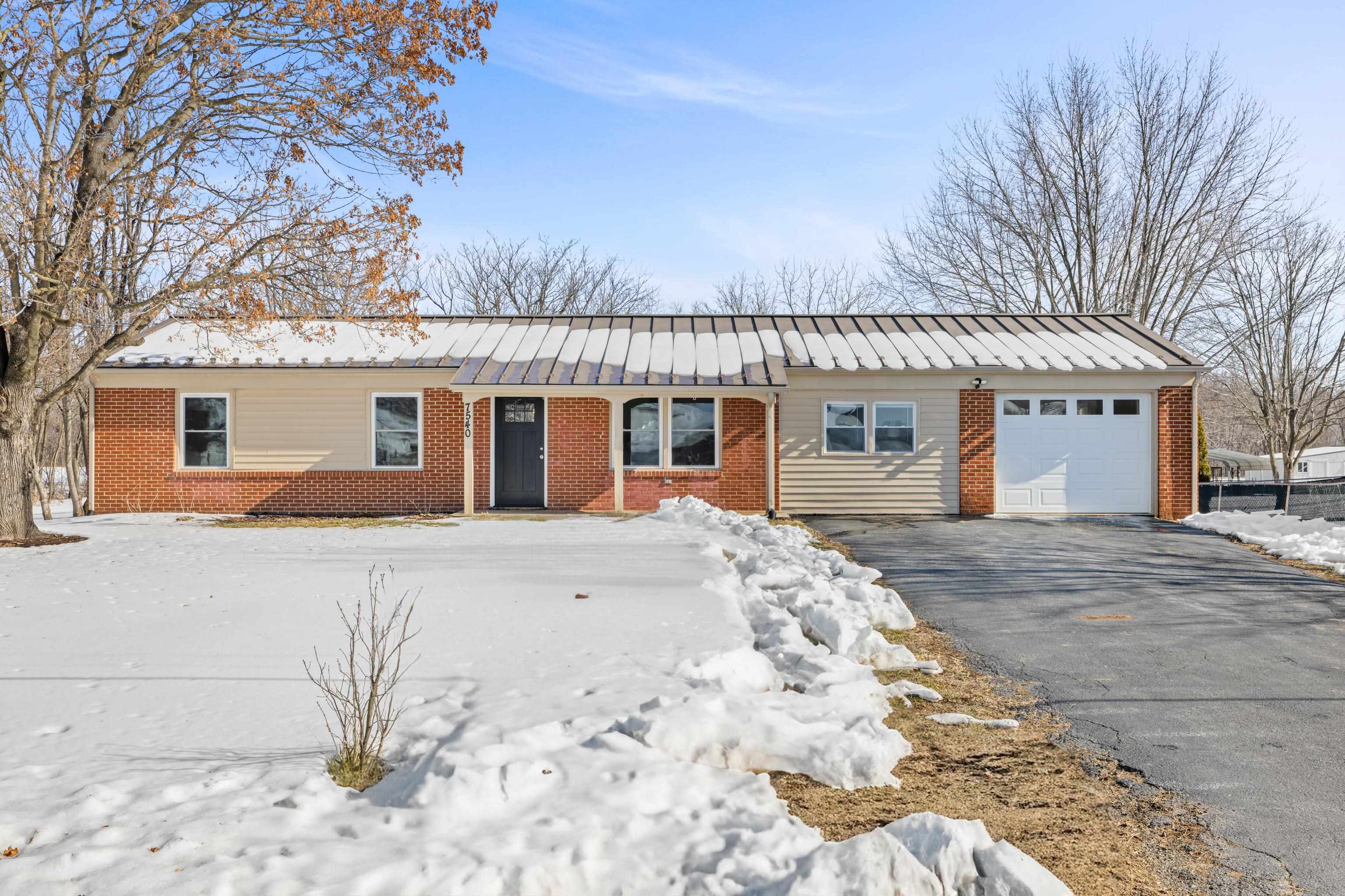 7540 Spring Creek Road Bridgewater, VA 22812 - Photo 1 of 42 a front view of a house with a dirt yard