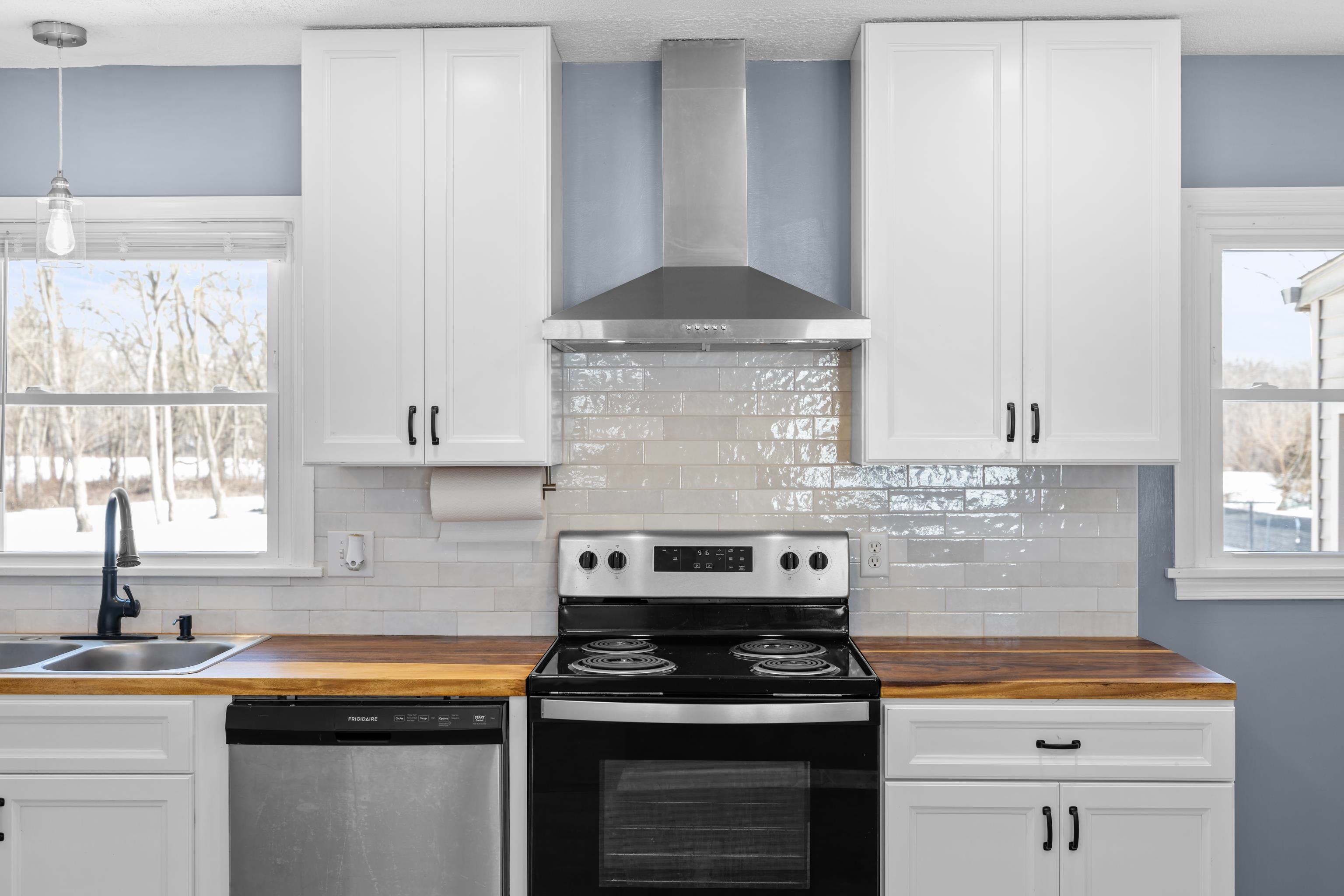 7540 Spring Creek Road Bridgewater, VA 22812 - Photo 11 of 42 a kitchen with stainless steel appliances a stove a sink and a window