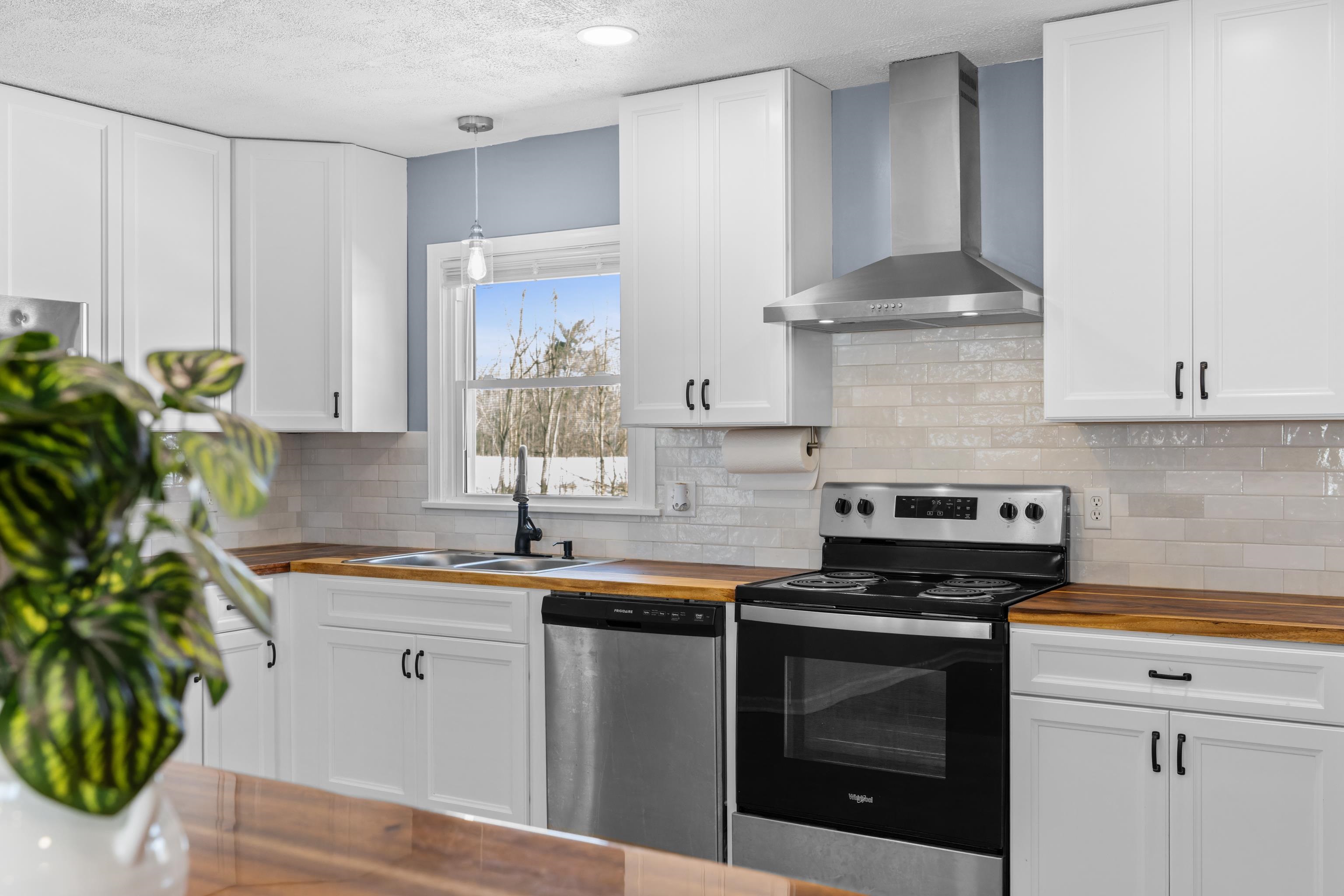 7540 Spring Creek Road Bridgewater, VA 22812 - Photo 13 of 42 a kitchen with appliances a sink and cabinets
