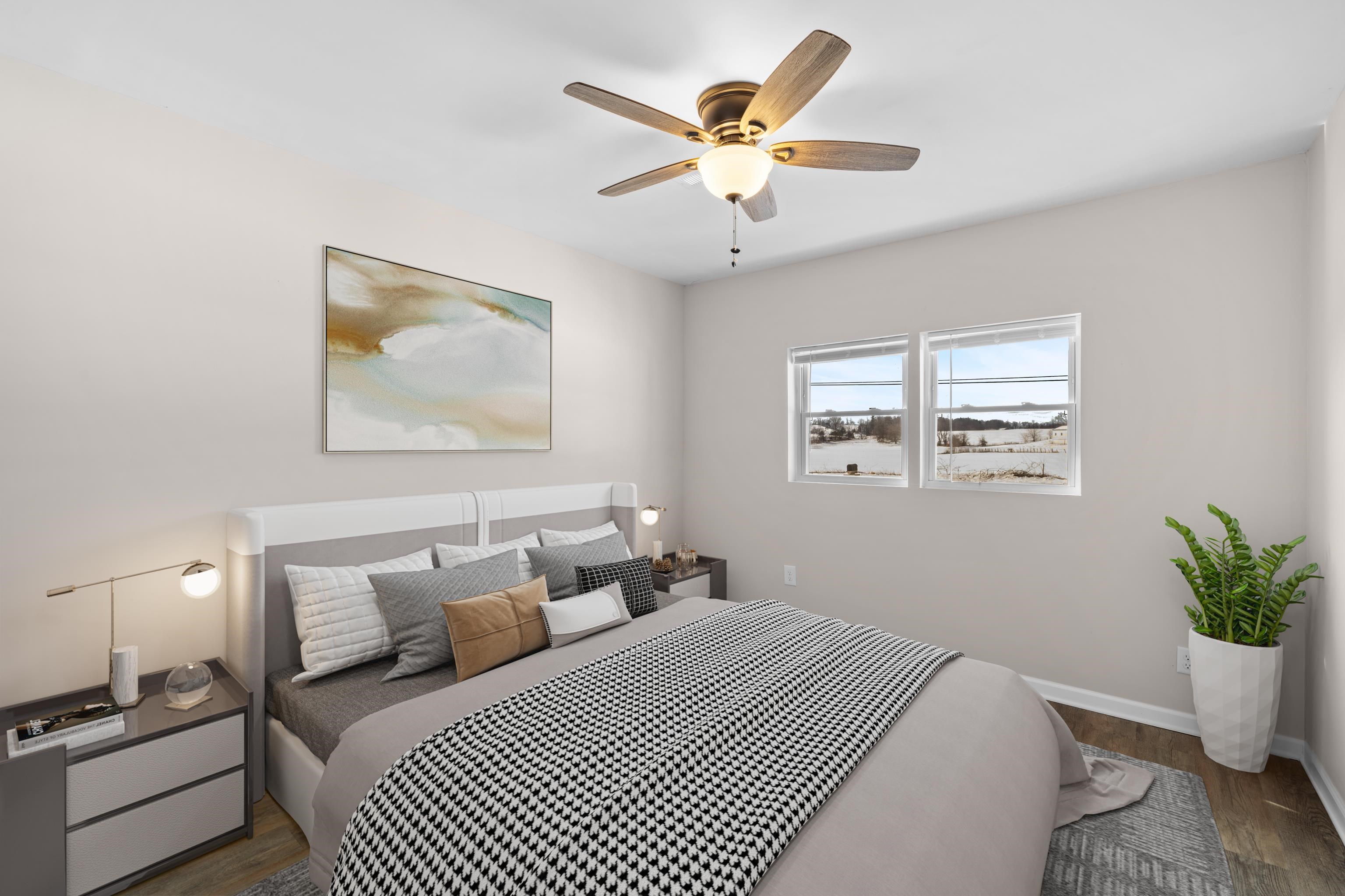 7540 Spring Creek Road Bridgewater, VA 22812 - Photo 14 of 42 a bedroom with a large bed and a chandelier