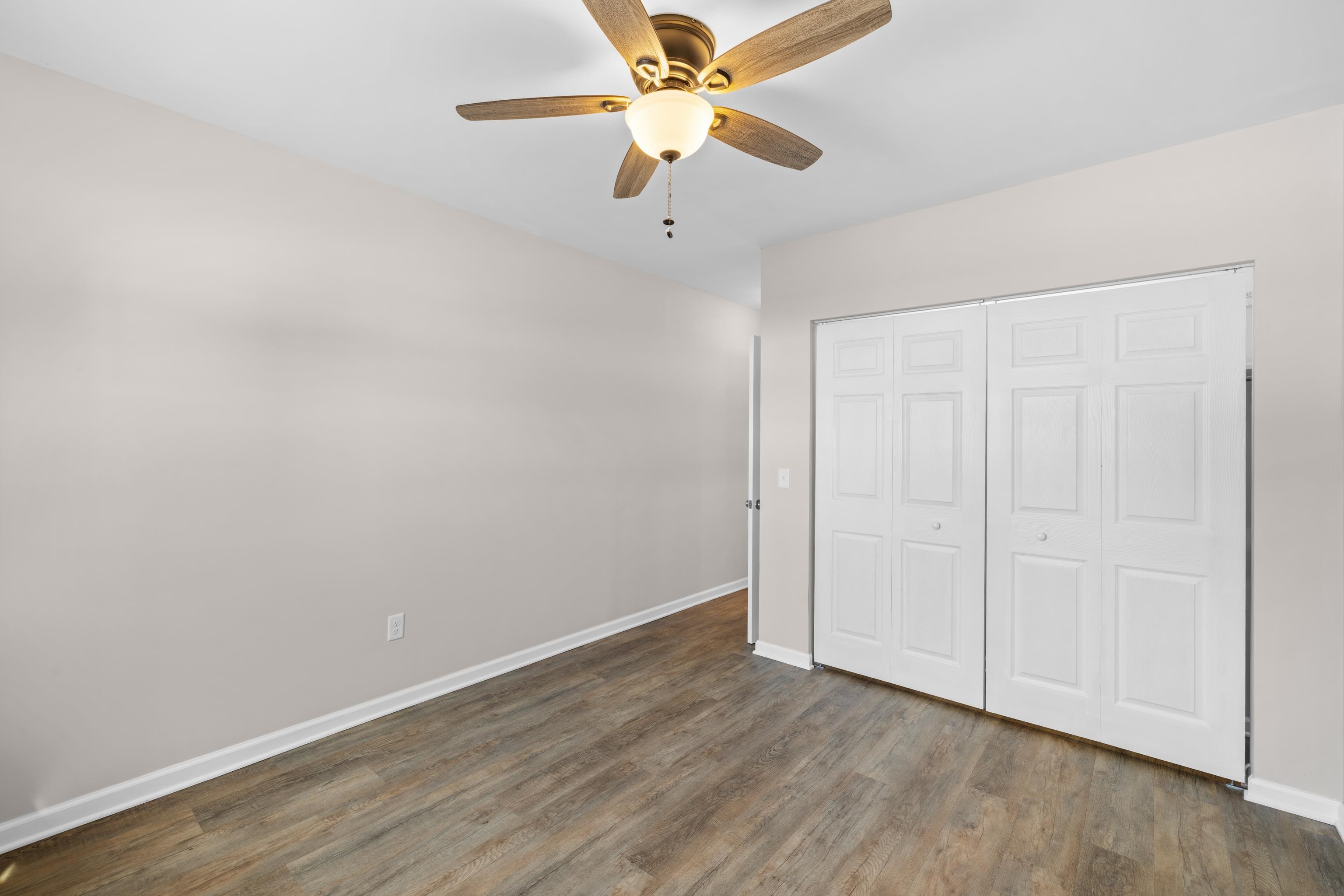 7540 Spring Creek Road Bridgewater, VA 22812 - Photo 16 of 42 a view of an empty room with window and a ceiling fan