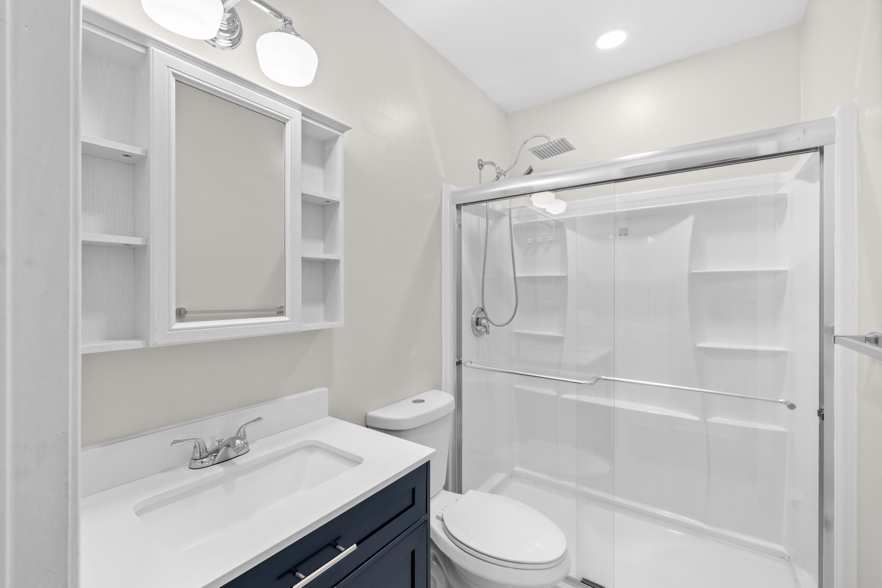 7540 Spring Creek Road Bridgewater, VA 22812 - Photo 17 of 42 a bathroom with a sink a toilet and shower