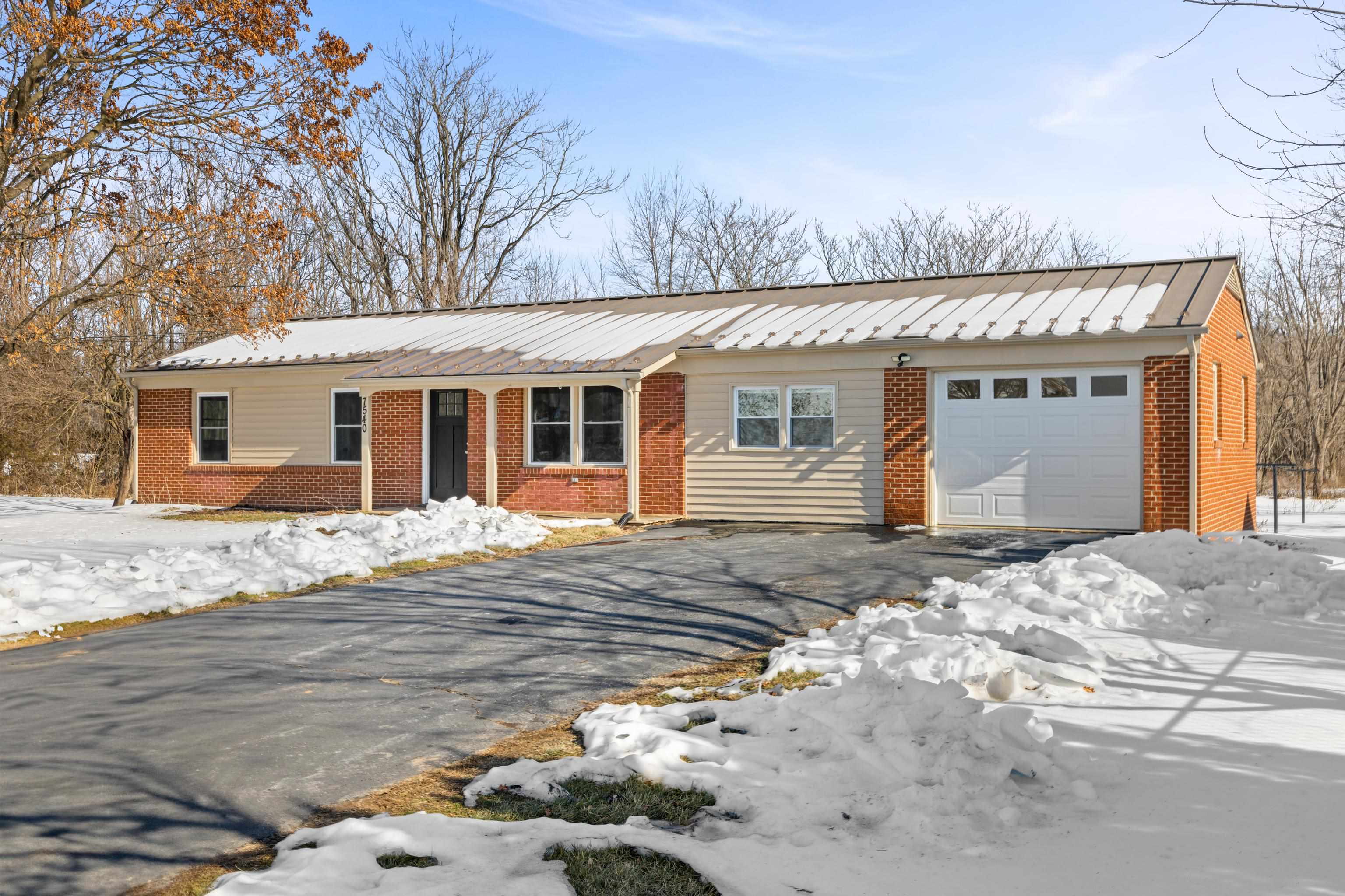 7540 Spring Creek Road Bridgewater, VA 22812 - Photo 2 of 42 a front view of a house with a empty space