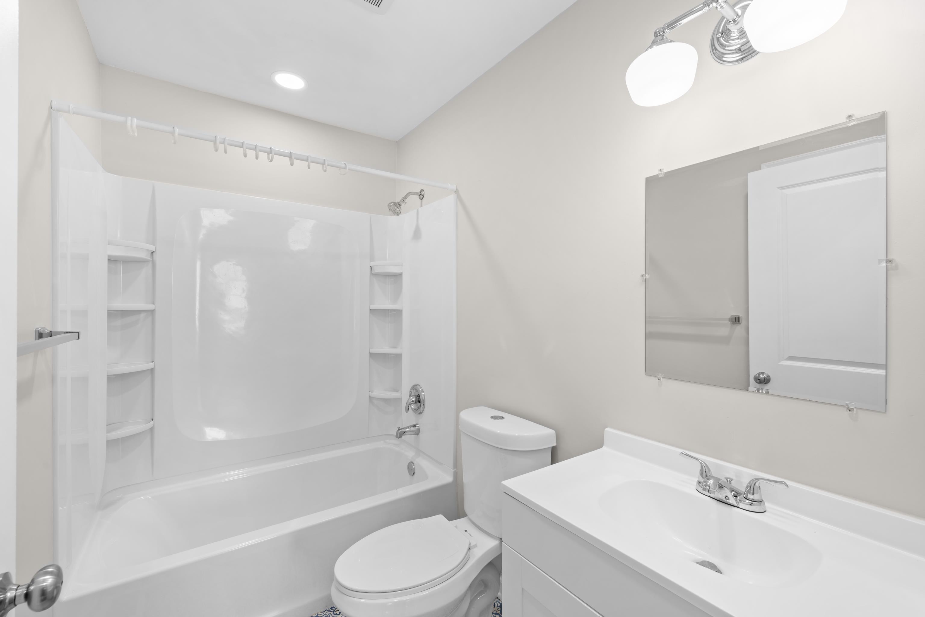 7540 Spring Creek Road Bridgewater, VA 22812 - Photo 23 of 42 a bathroom with a bathtub shower sink vanity mirror and toilet