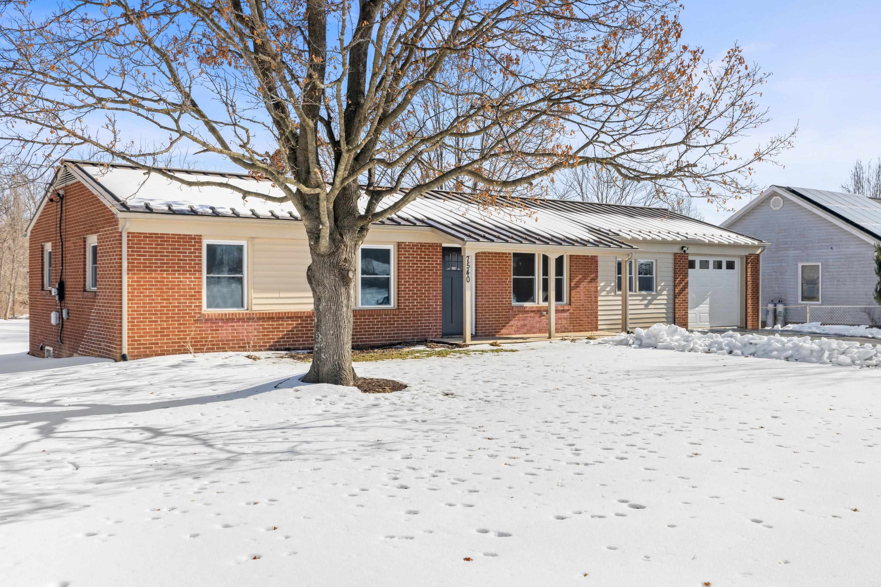 7540 Spring Creek Road Bridgewater, VA 22812 - Photo 3 of 42 a front view of house with yard and trees around