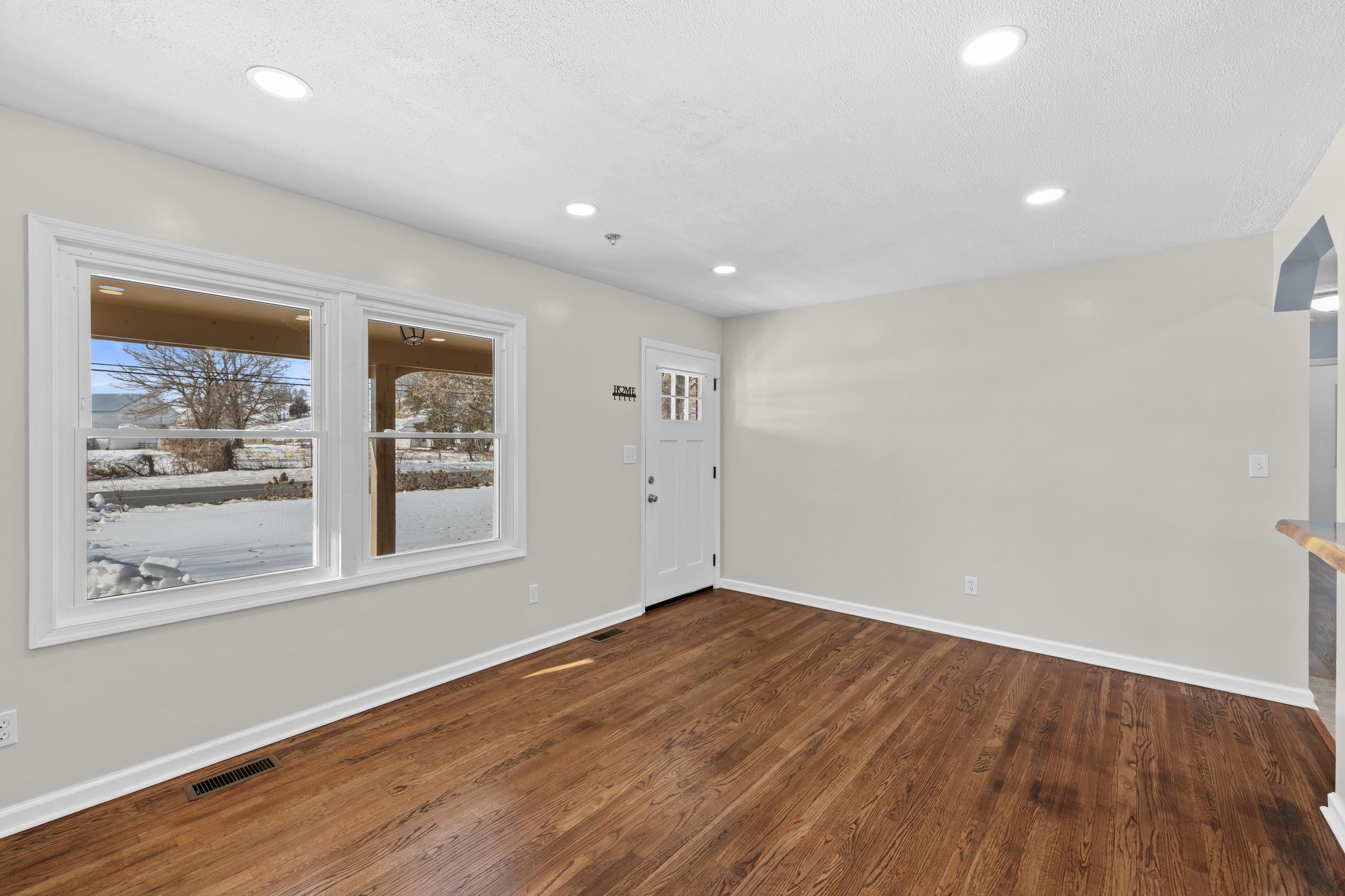 7540 Spring Creek Road Bridgewater, VA 22812 - Photo 7 of 42 a view of empty room with wooden floor and fan