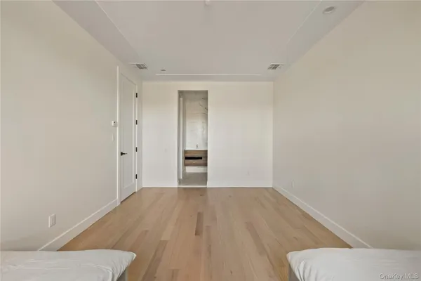 a view of a hallway with washer and dryer