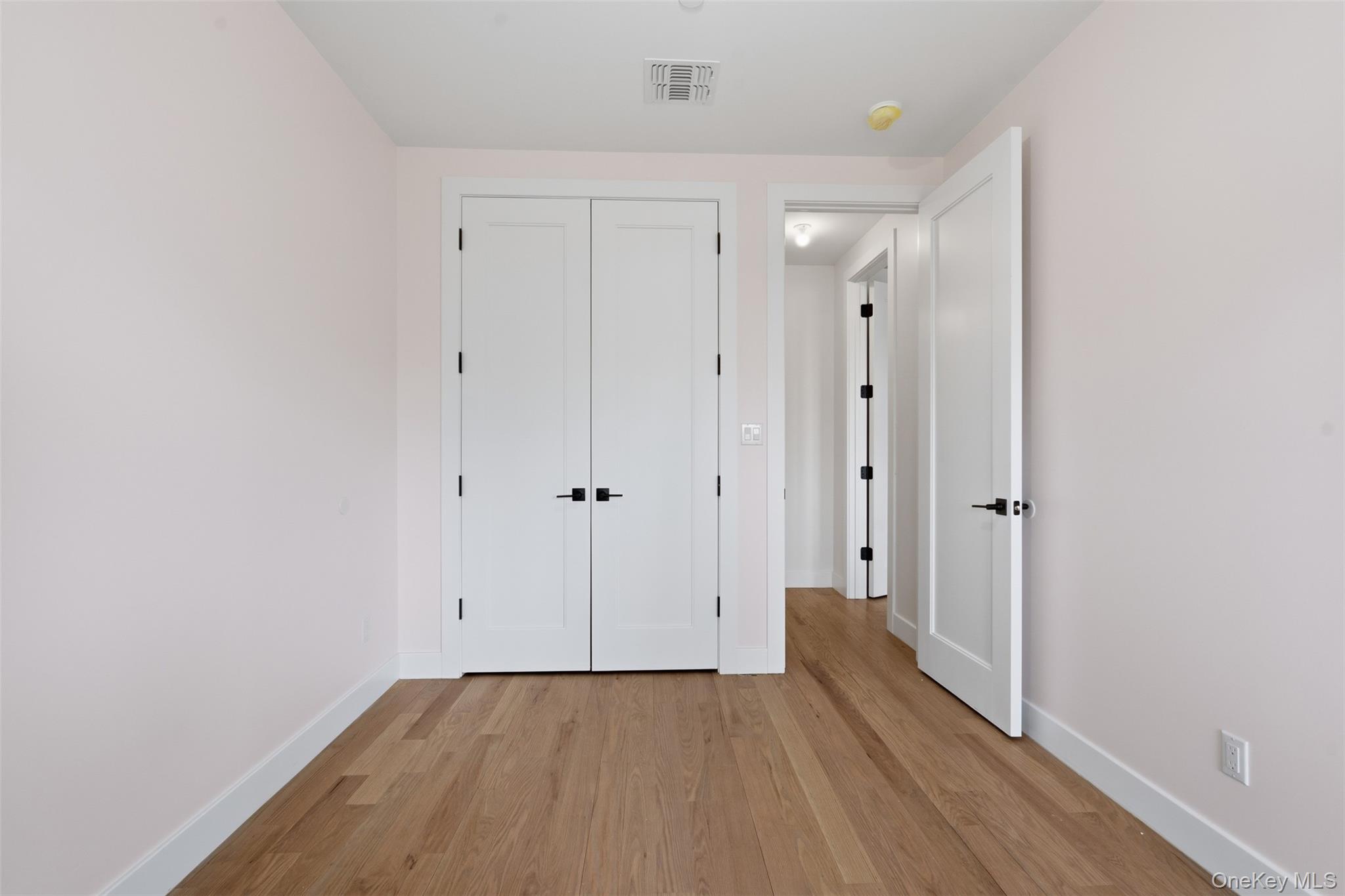 7 Valley Way, Unit 321 Spring Valley, NY 10977 - Photo 35 of 50 a view of a hallway with wooden floor