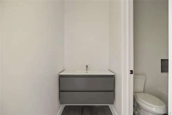 a white bath tub sitting next to a white toilet