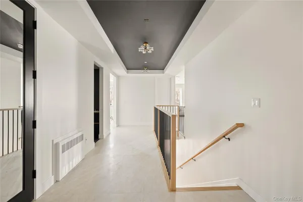 a view of a hallway with staircase