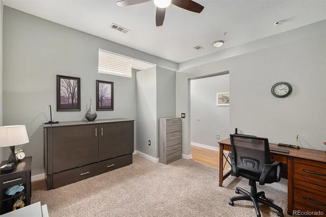 a workspace with furniture and window