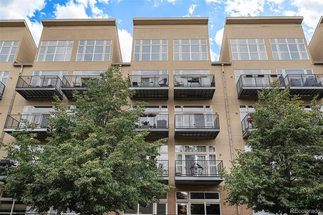 a view of a building with a tree
