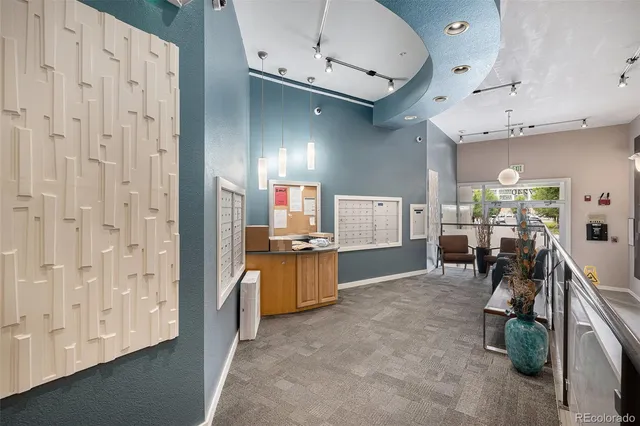 a kitchen with stainless steel appliances kitchen island granite countertop a stove and a sink