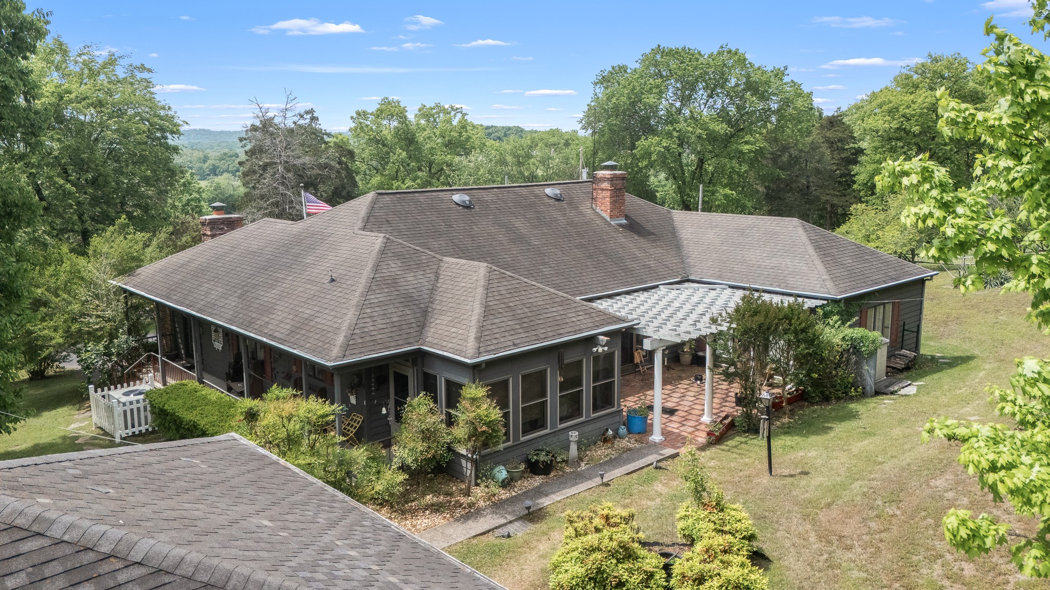 32 Grisham Road Fayetteville, TN 37334 - Photo 2 of 15 a aerial view of a house with yard and trees in the background
