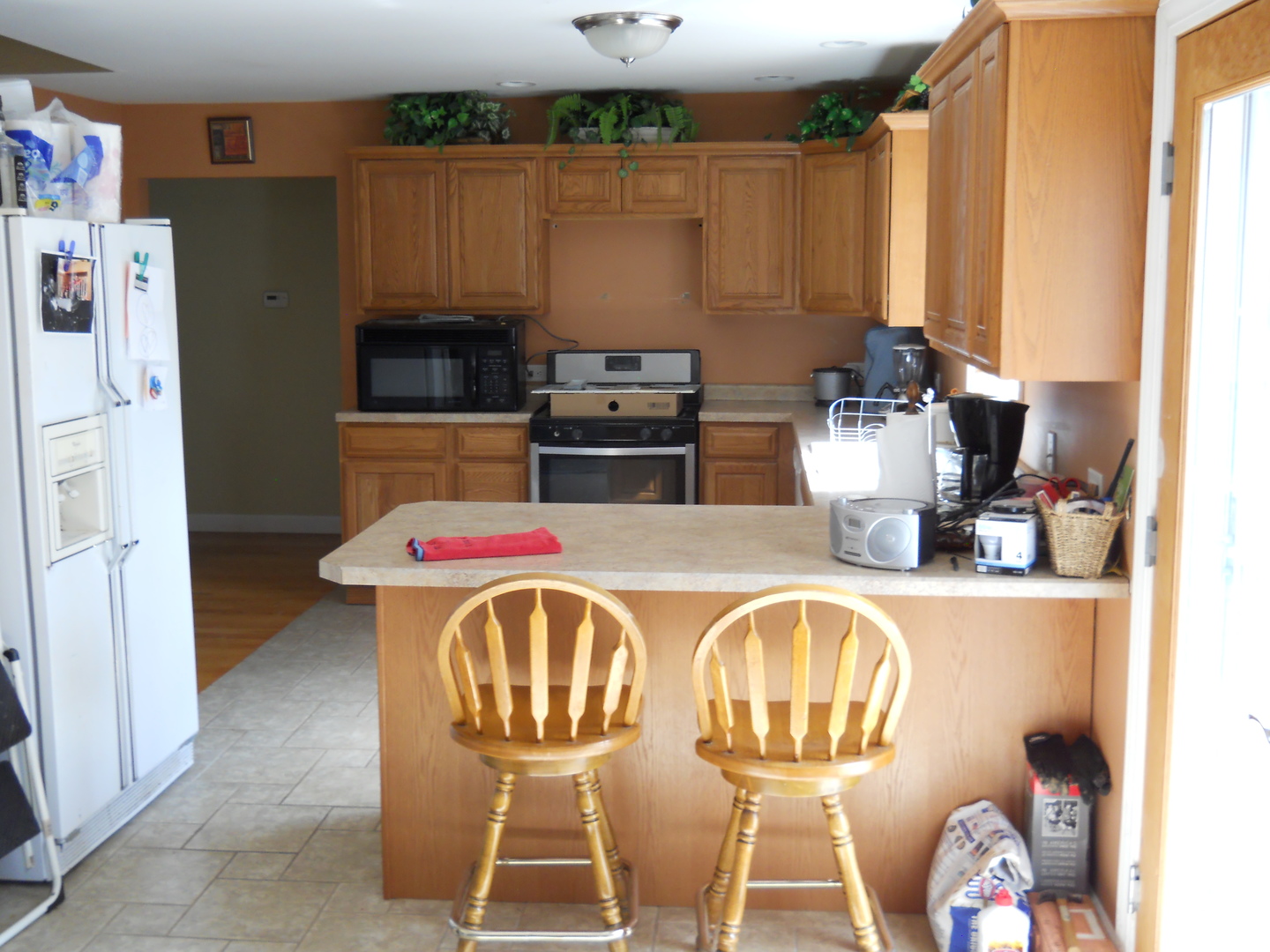 7 Cedar Lane Putnam, IL 61560 - Photo 7 of 11 a kitchen with a refrigerator and a stove top oven