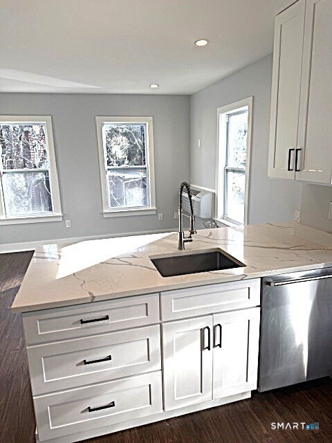 18 Harding Place Danbury, CT 06810 - Photo 3 of 7 a bathroom with a sink and a window