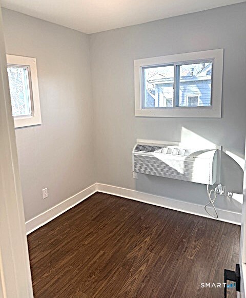 18 Harding Place Danbury, CT 06810 - Photo 6 of 7 a view of an empty room with wooden floor and a window