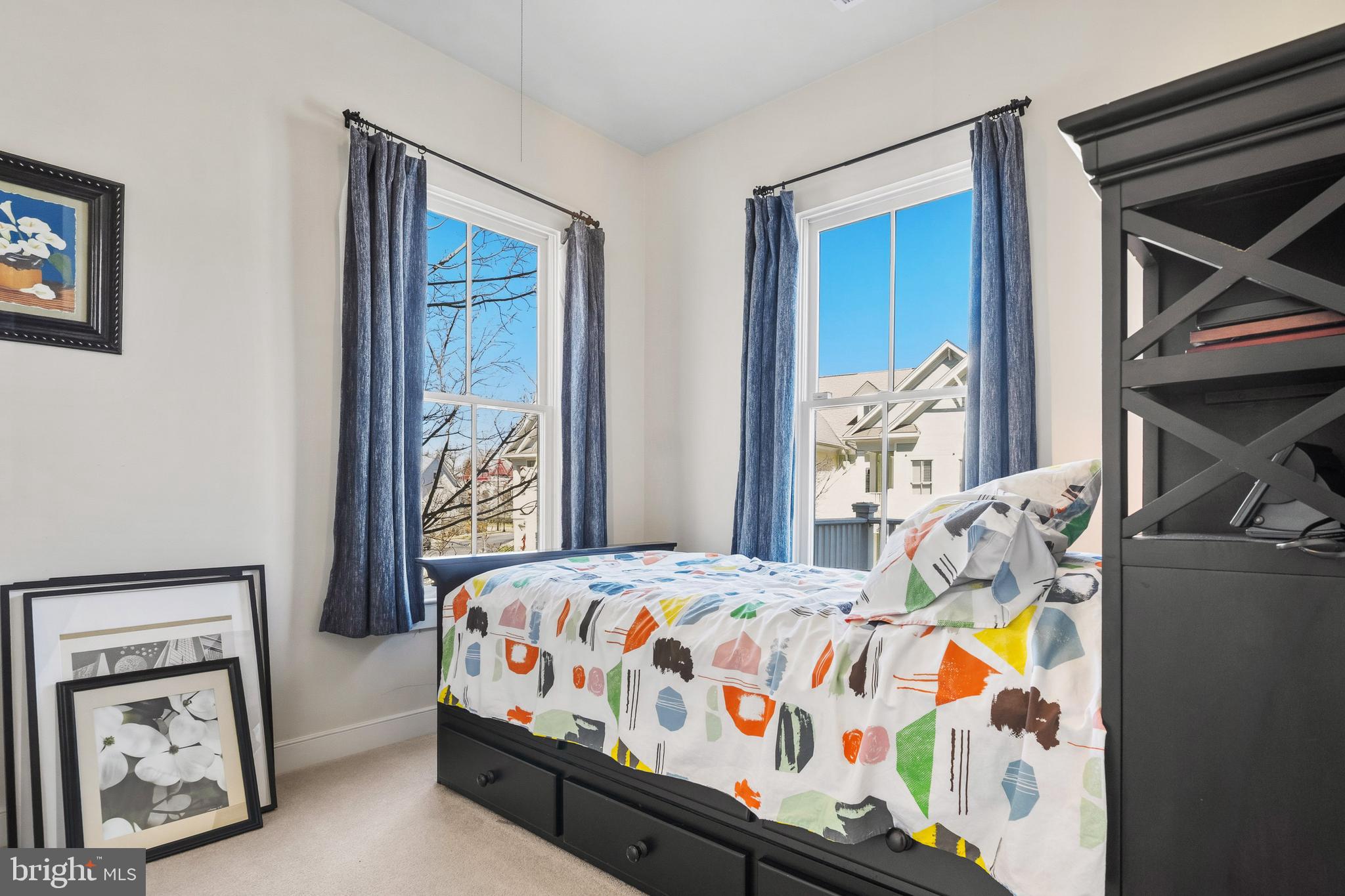 9530 Ament Street Silver Spring, MD 20910 - Photo 19 of 55 a bedroom with bed and painting on the wall