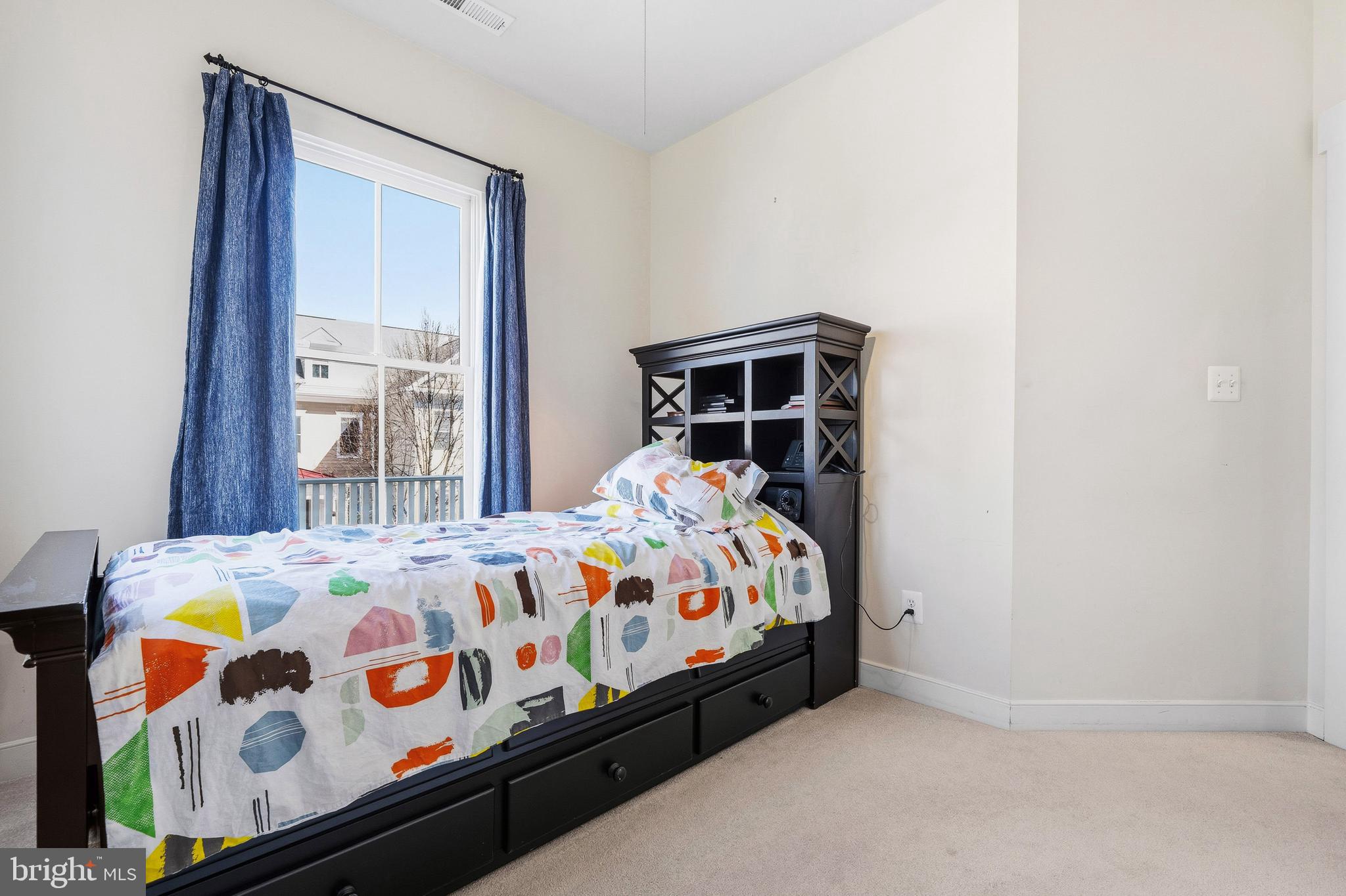 9530 Ament Street Silver Spring, MD 20910 - Photo 20 of 55 a bedroom with a bed and a window