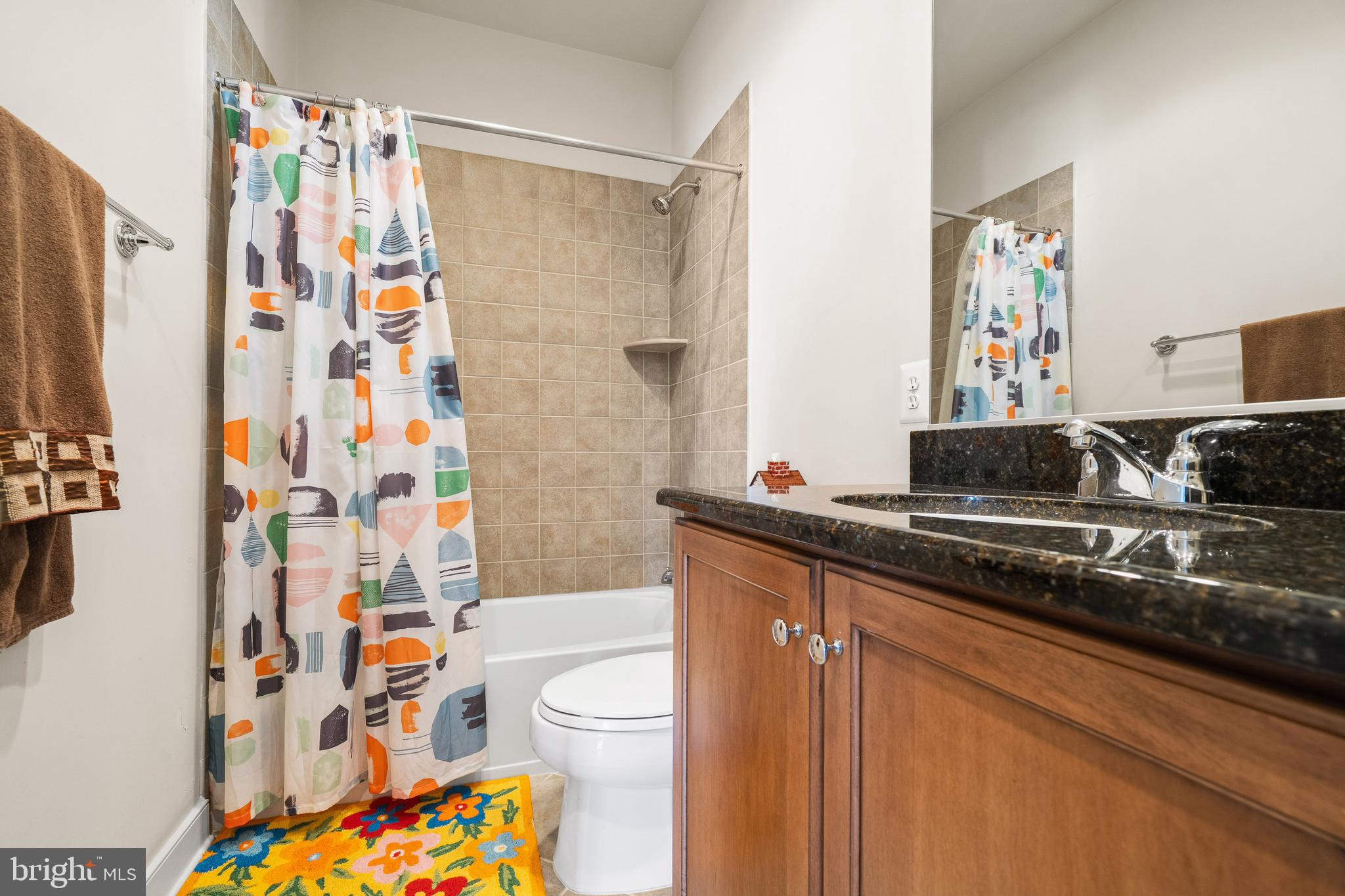 9530 Ament Street Silver Spring, MD 20910 - Photo 23 of 55 a bathroom with a sink toilet and shower