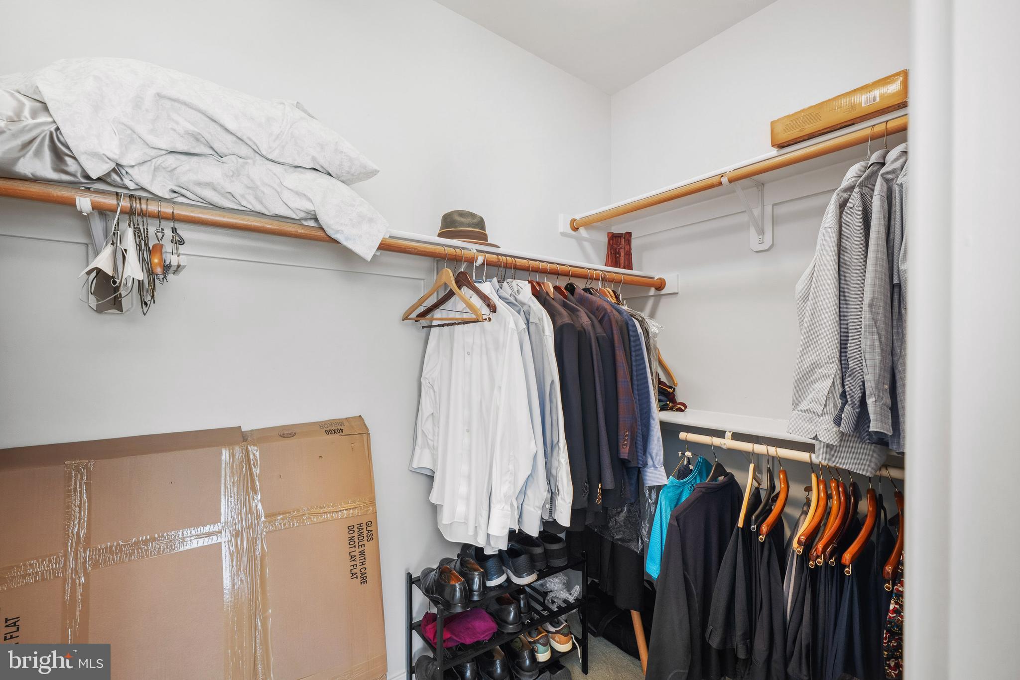 9530 Ament Street Silver Spring, MD 20910 - Photo 27 of 55 a view of walk in closet with clothes and shoes