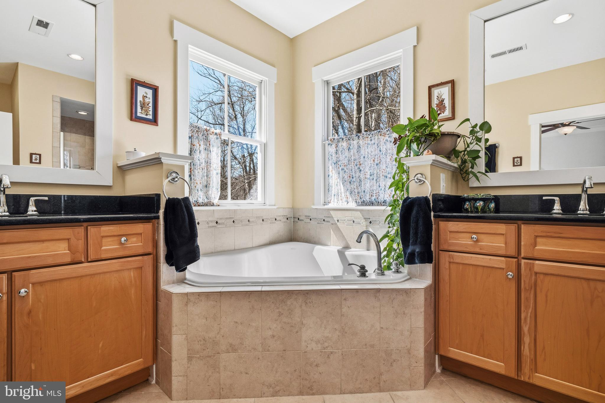 9530 Ament Street Silver Spring, MD 20910 - Photo 28 of 55 a kitchen with stainless steel appliances granite countertop a sink a stove and a refrigerator