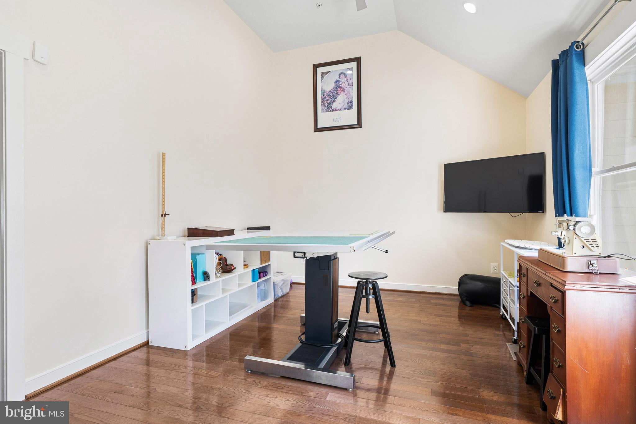 9530 Ament Street Silver Spring, MD 20910 - Photo 32 of 55 a view of a livingroom with workspace and a flat screen tv
