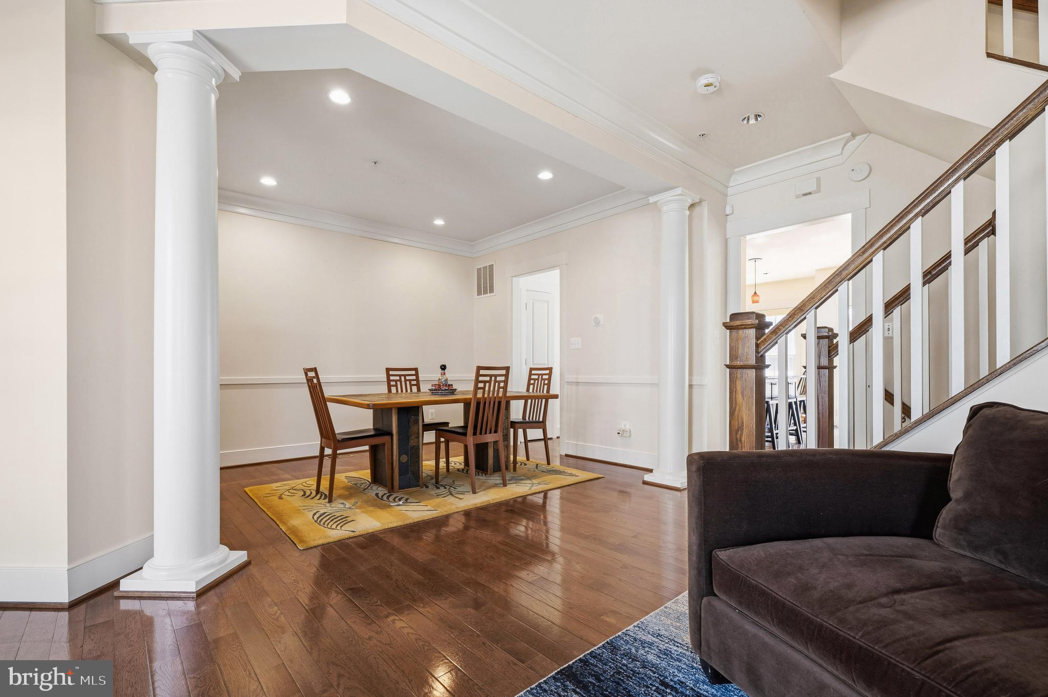 9530 Ament Street Silver Spring, MD 20910 - Photo 4 of 55 a living room with furniture and a dining table with wooden floor