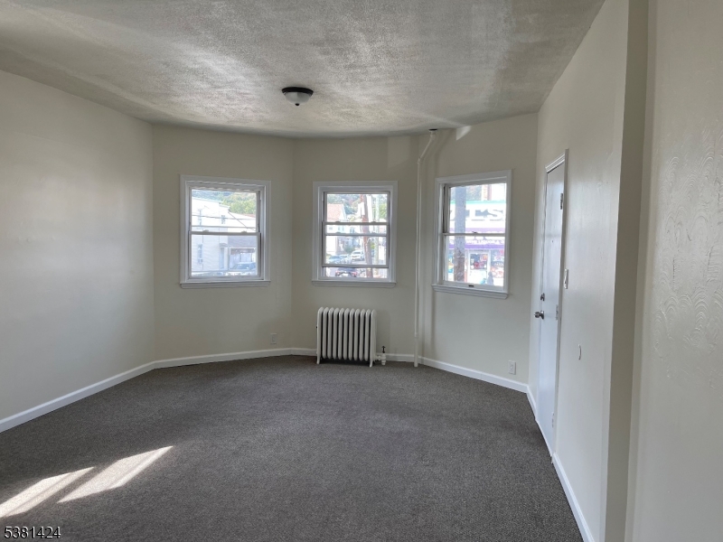 242 Union Avenue Paterson, NJ 07502 - Photo 2 of 10 a view of an empty room with a window