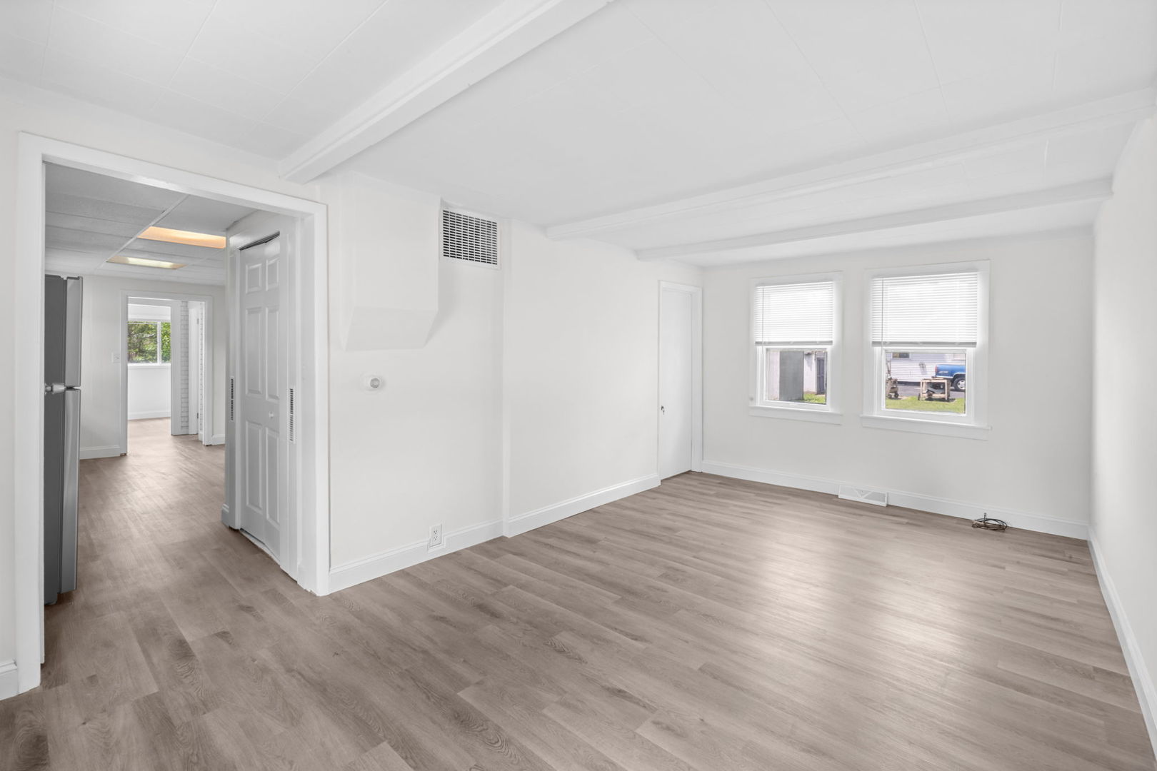 37714 North Nippersink Place Spring Grove, IL 60081 - Photo 4 of 16 an empty room with wooden floor and windows