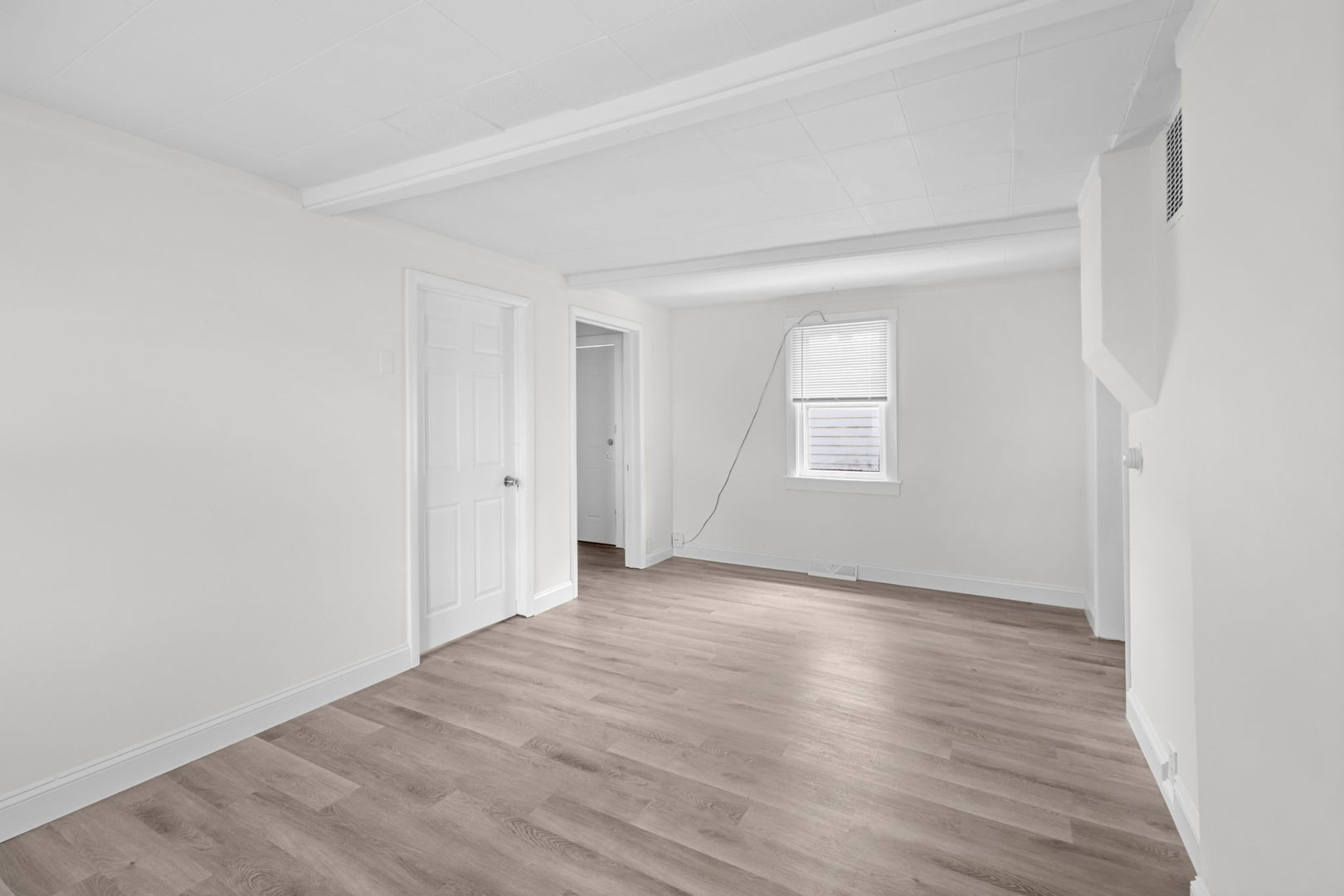 37714 North Nippersink Place Spring Grove, IL 60081 - Photo 5 of 16 an empty room with wooden floor and windows