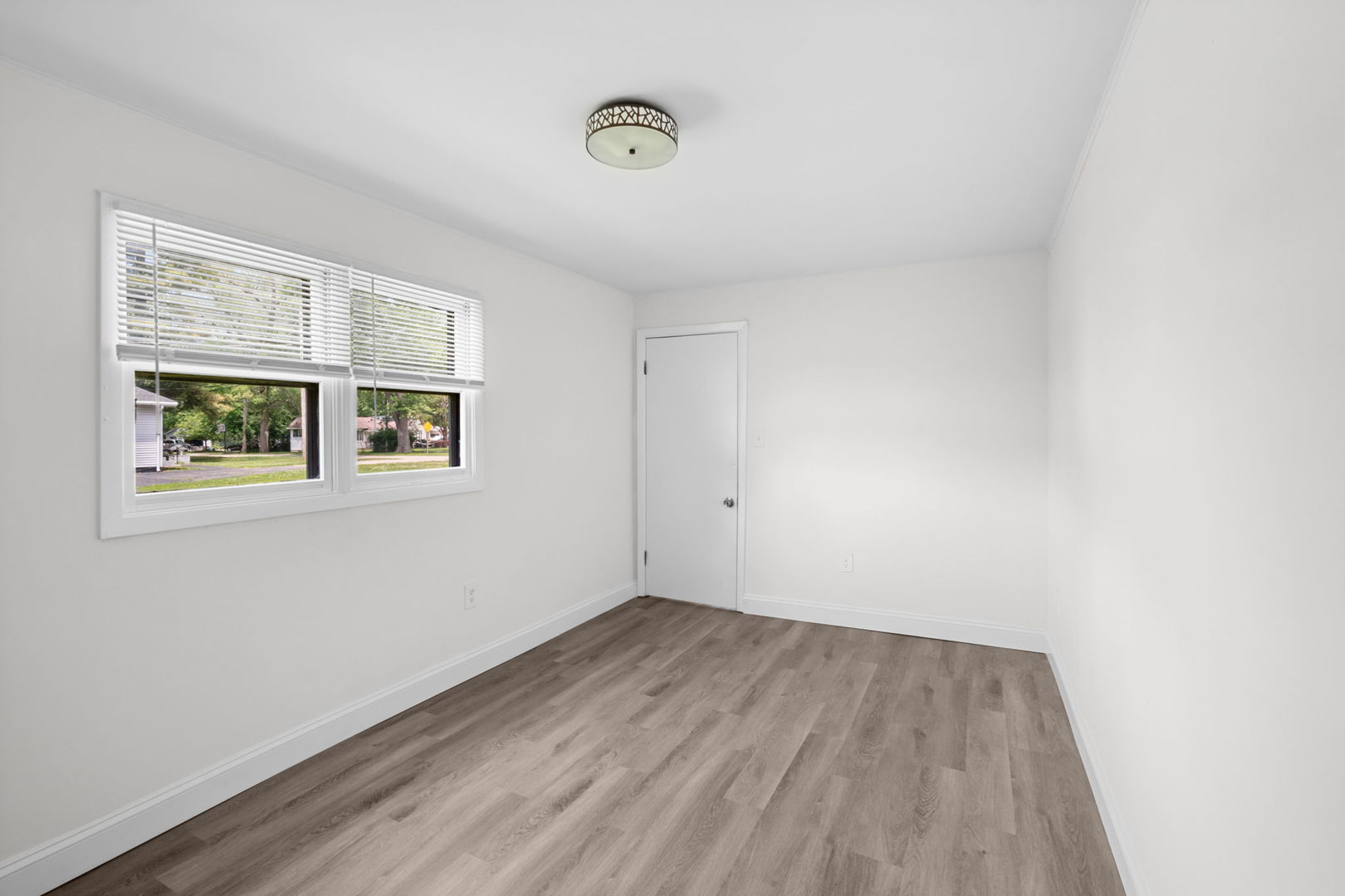 37714 North Nippersink Place Spring Grove, IL 60081 - Photo 7 of 16 a view of a room with wooden floor and window