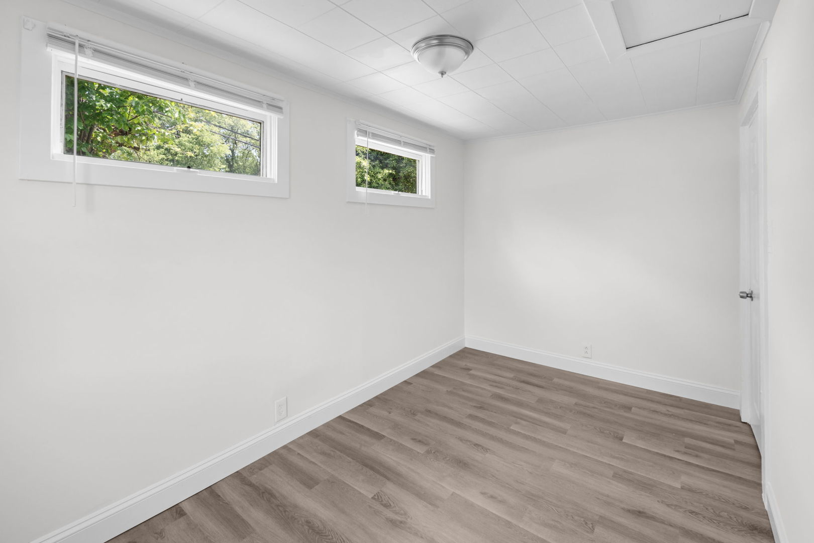 37714 North Nippersink Place Spring Grove, IL 60081 - Photo 9 of 16 an empty room with wooden floor and window