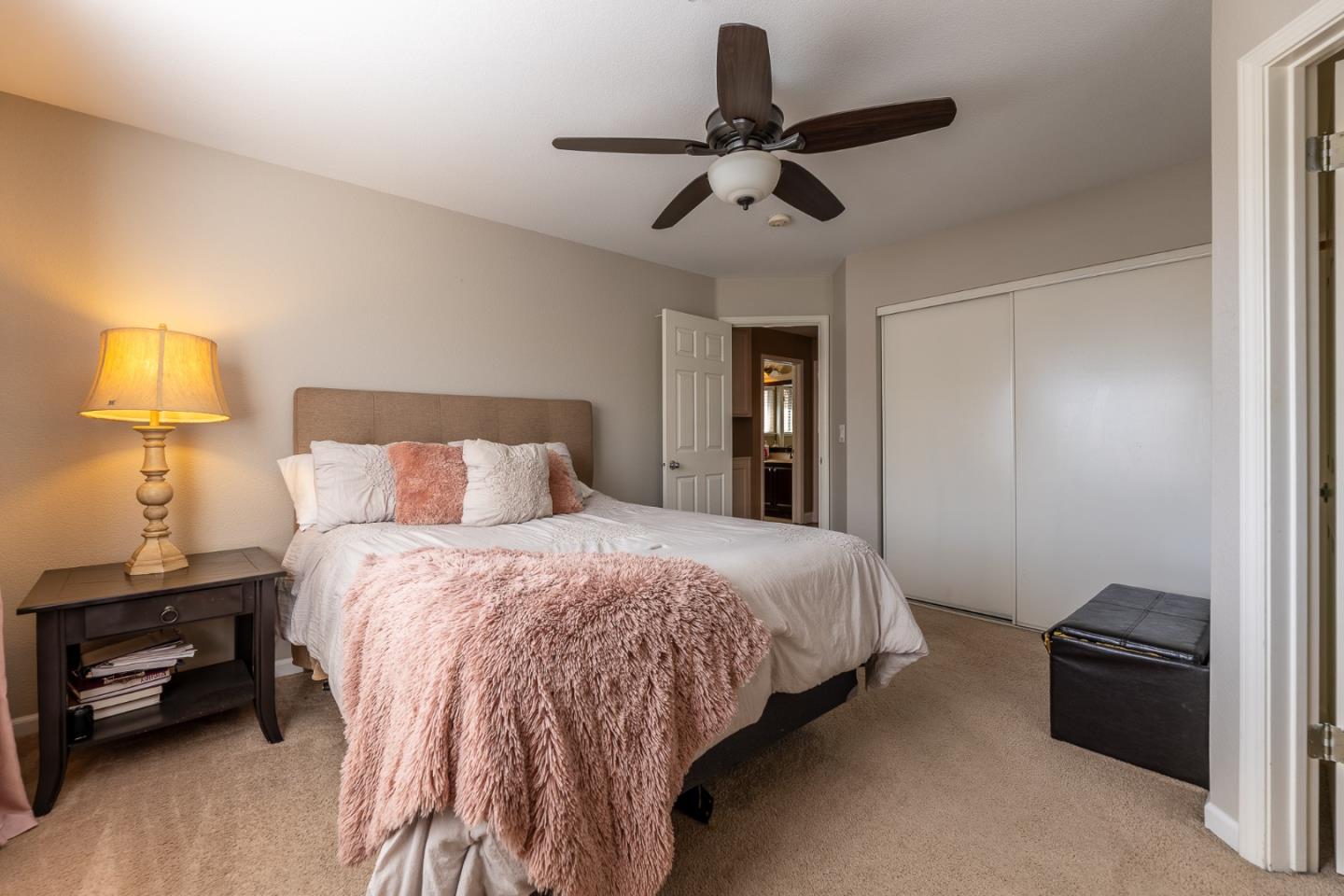 1118 Eagle Drive Salinas, CA 93905 - Photo 16 of 30 a bedroom with a bed and a lamp