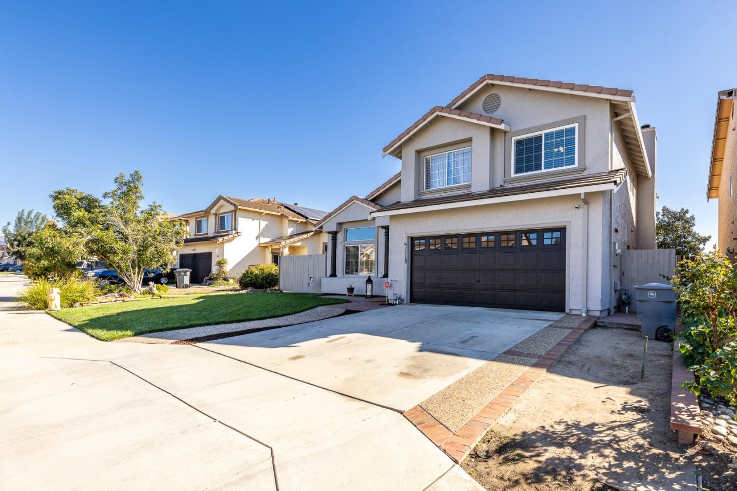 1118 Eagle Drive Salinas, CA 93905 - Photo 2 of 30 a front view of a house with a yard and garage