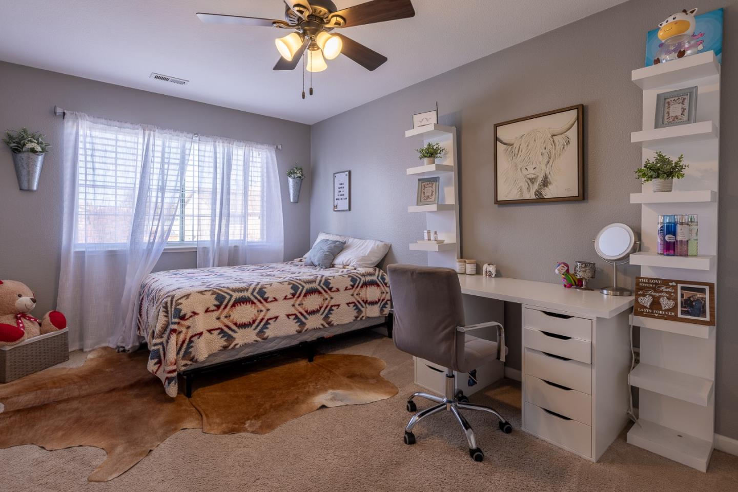 1118 Eagle Drive Salinas, CA 93905 - Photo 27 of 30 a bedroom with a bed and a chandelier