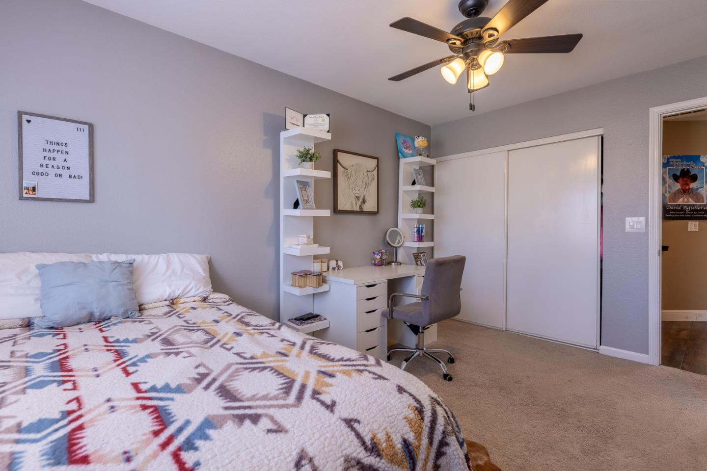 1118 Eagle Drive Salinas, CA 93905 - Photo 28 of 30 a bedroom with a bed and a chandelier